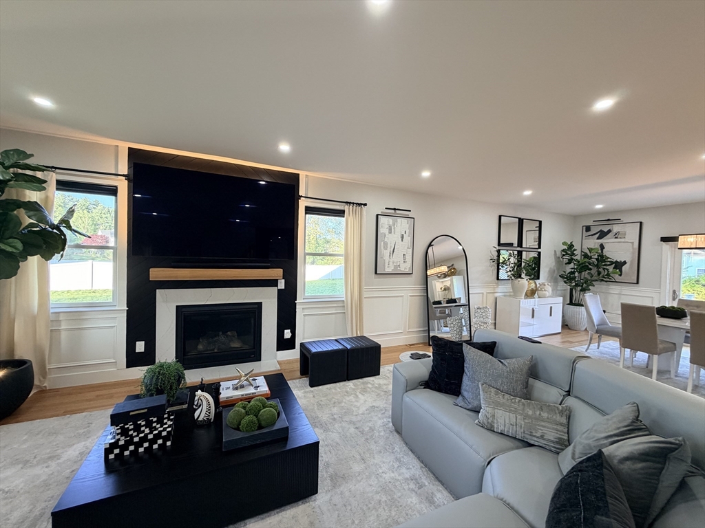 6 Rivendell Lane Millis, MA 02054 - Photo 23 of 33 a living room with furniture and a fireplace