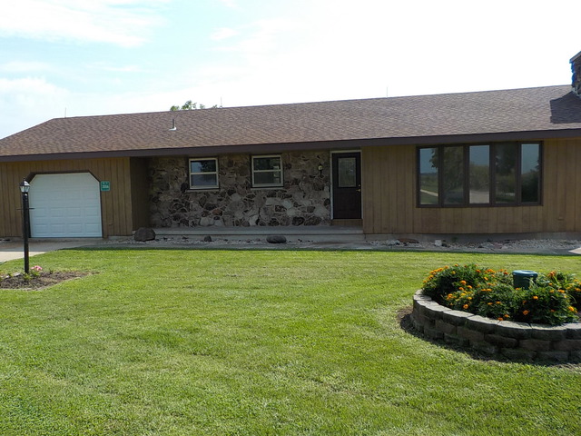 3006 Kane Road Leland, IL 60531 - Photo 1 of 21 a front view of a house with garden