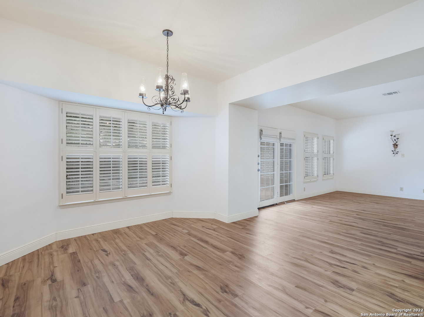 9231 Linbrooke San Antonio, TX 78250 - Photo 11 of 28 a view of a livingroom with wooden floor and a window