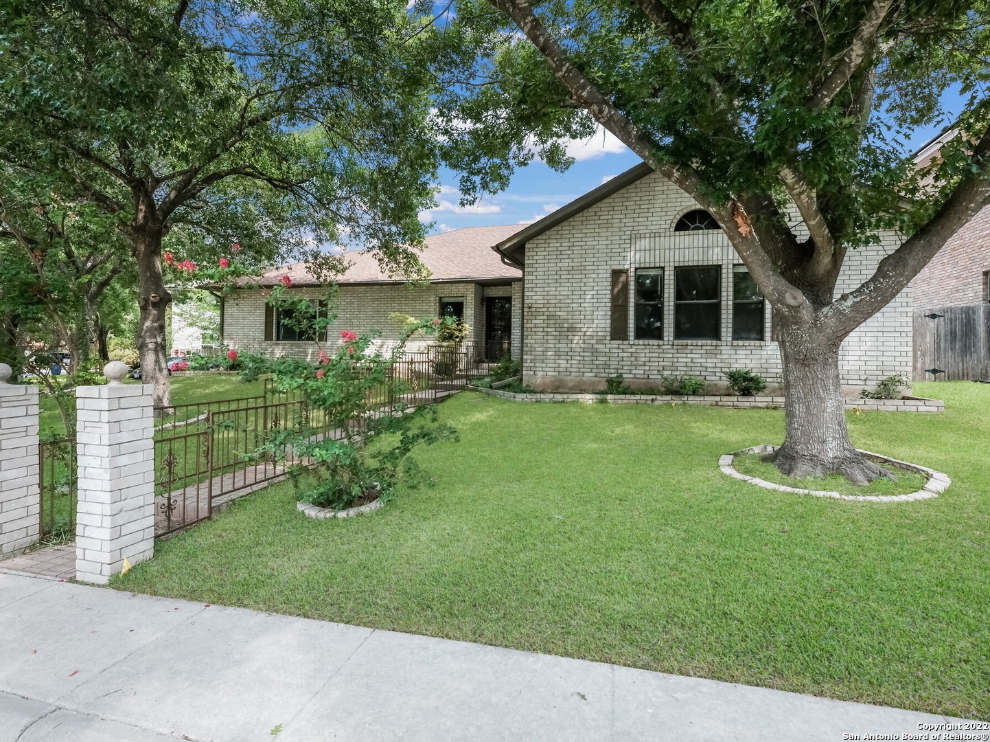 9231 Linbrooke San Antonio, TX 78250 - Photo 2 of 28 a front view of house with yard and green space