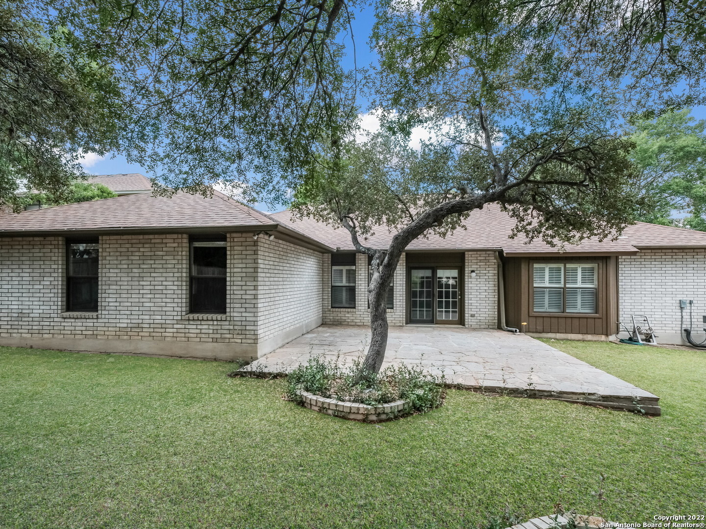 9231 Linbrooke San Antonio, TX 78250 - Photo 28 of 28 a front view of house with yard and green space