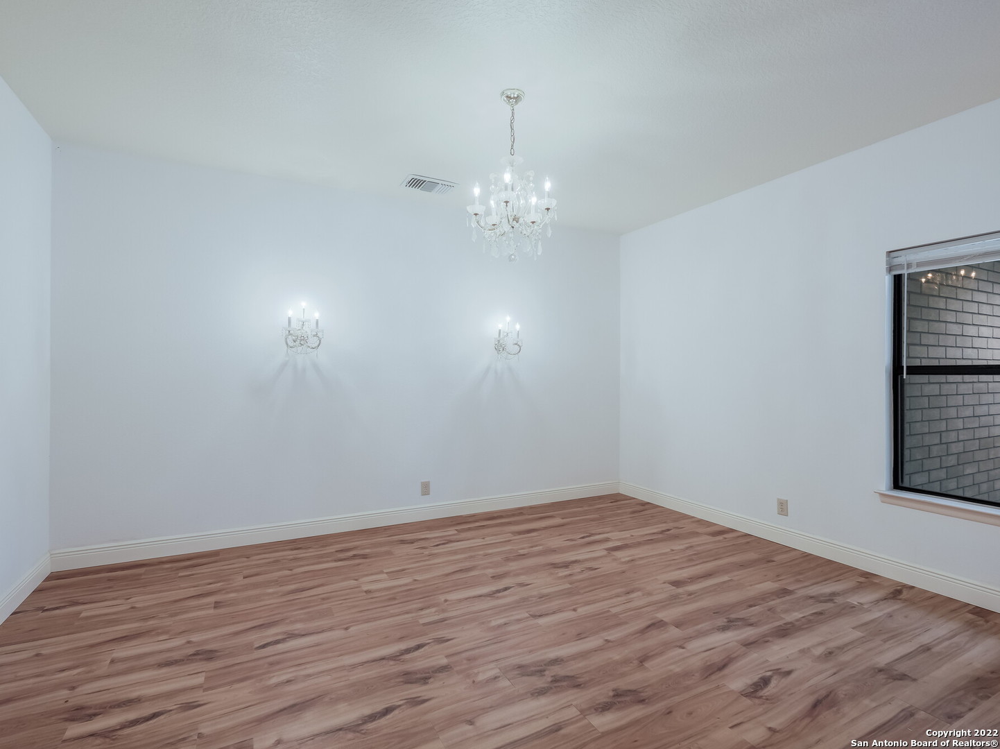 9231 Linbrooke San Antonio, TX 78250 - Photo 4 of 28 a view of empty room with wooden floor