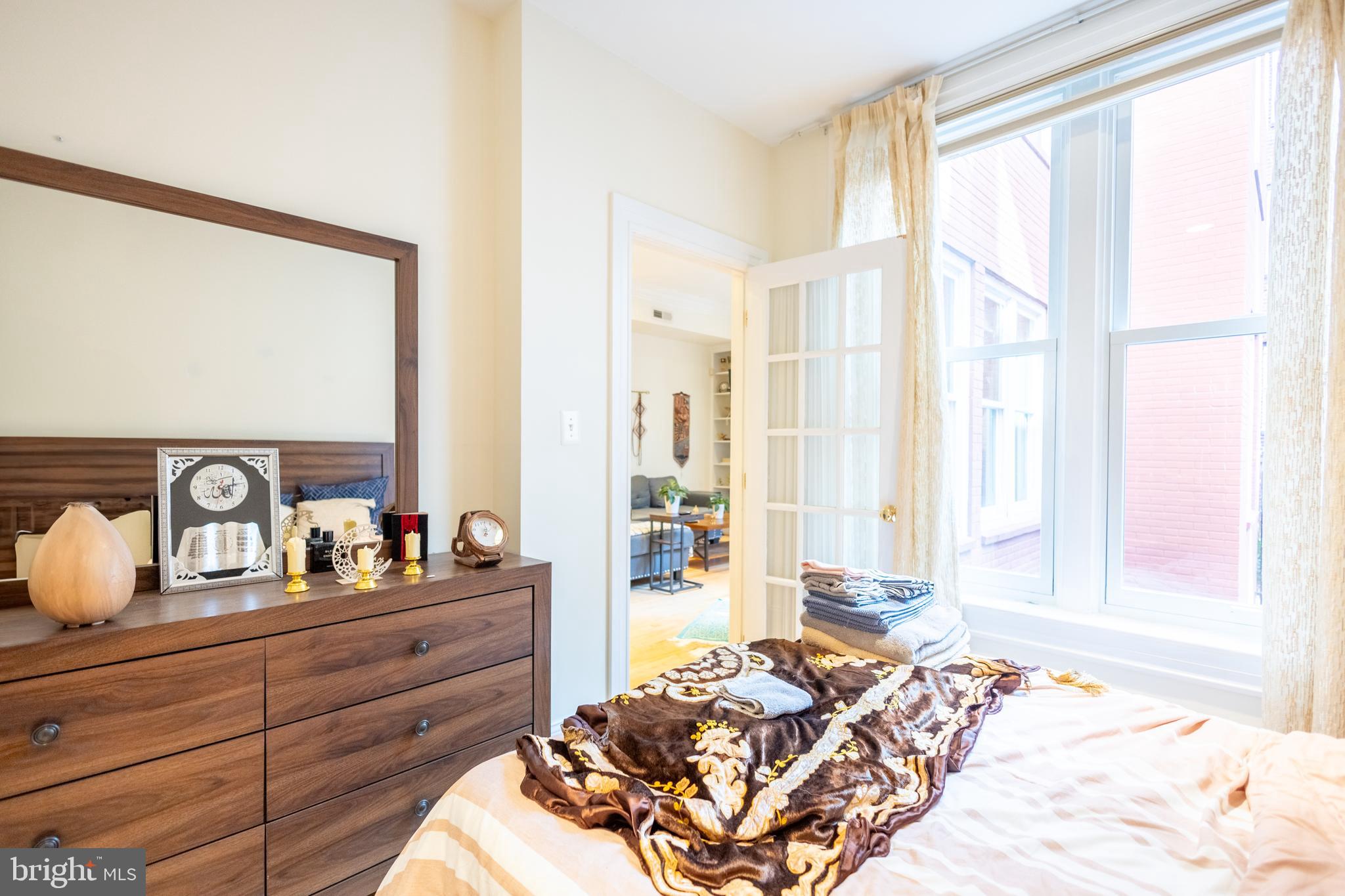 1520 O Street Northwest, Unit 104 Washington, DC 20005 - Photo 14 of 15 a bedroom with a bed and wooden floor