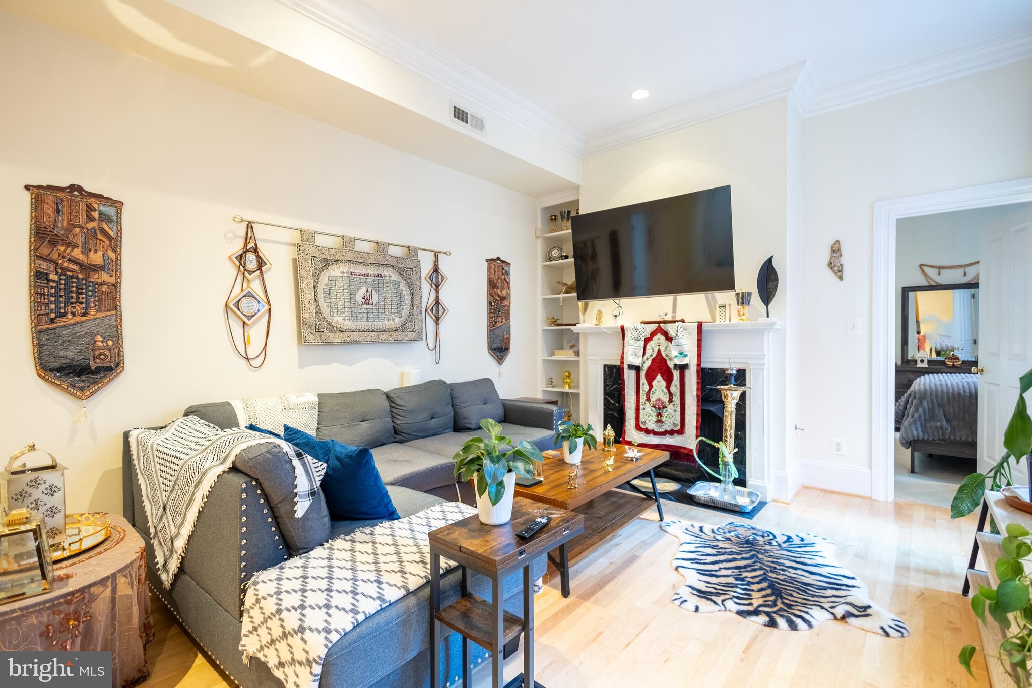 1520 O Street Northwest, Unit 104 Washington, DC 20005 - Photo 2 of 15 a living room with furniture and a flat screen tv