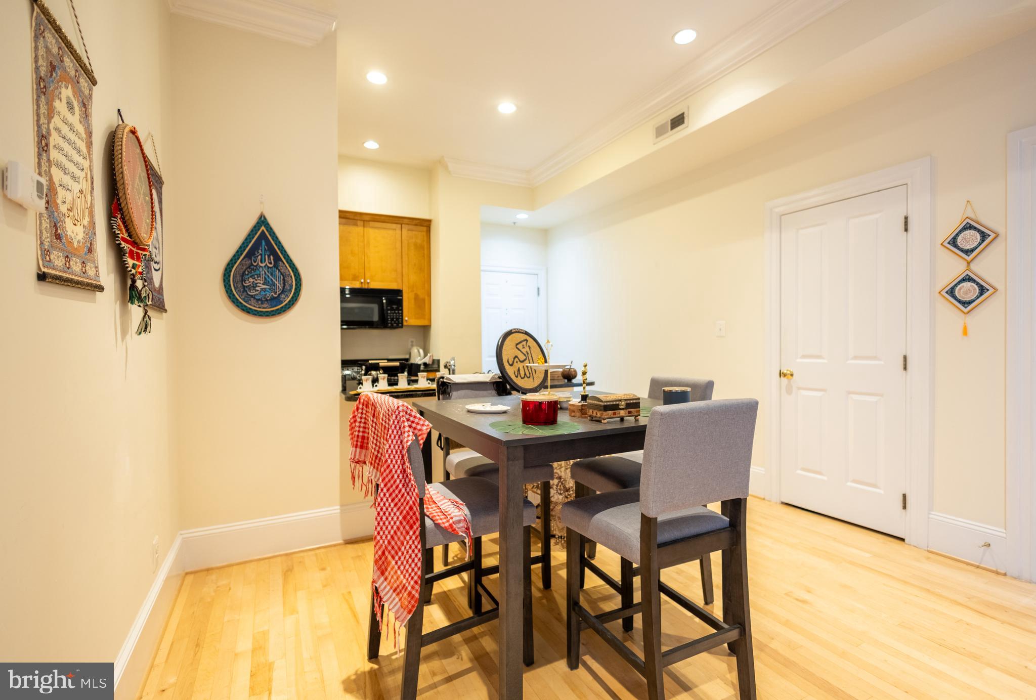 1520 O Street Northwest, Unit 104 Washington, DC 20005 - Photo 6 of 15 a view of a dining room with furniture and a table