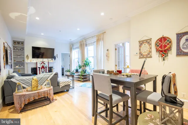 a view of a livingroom with furniture and a flat screen tv