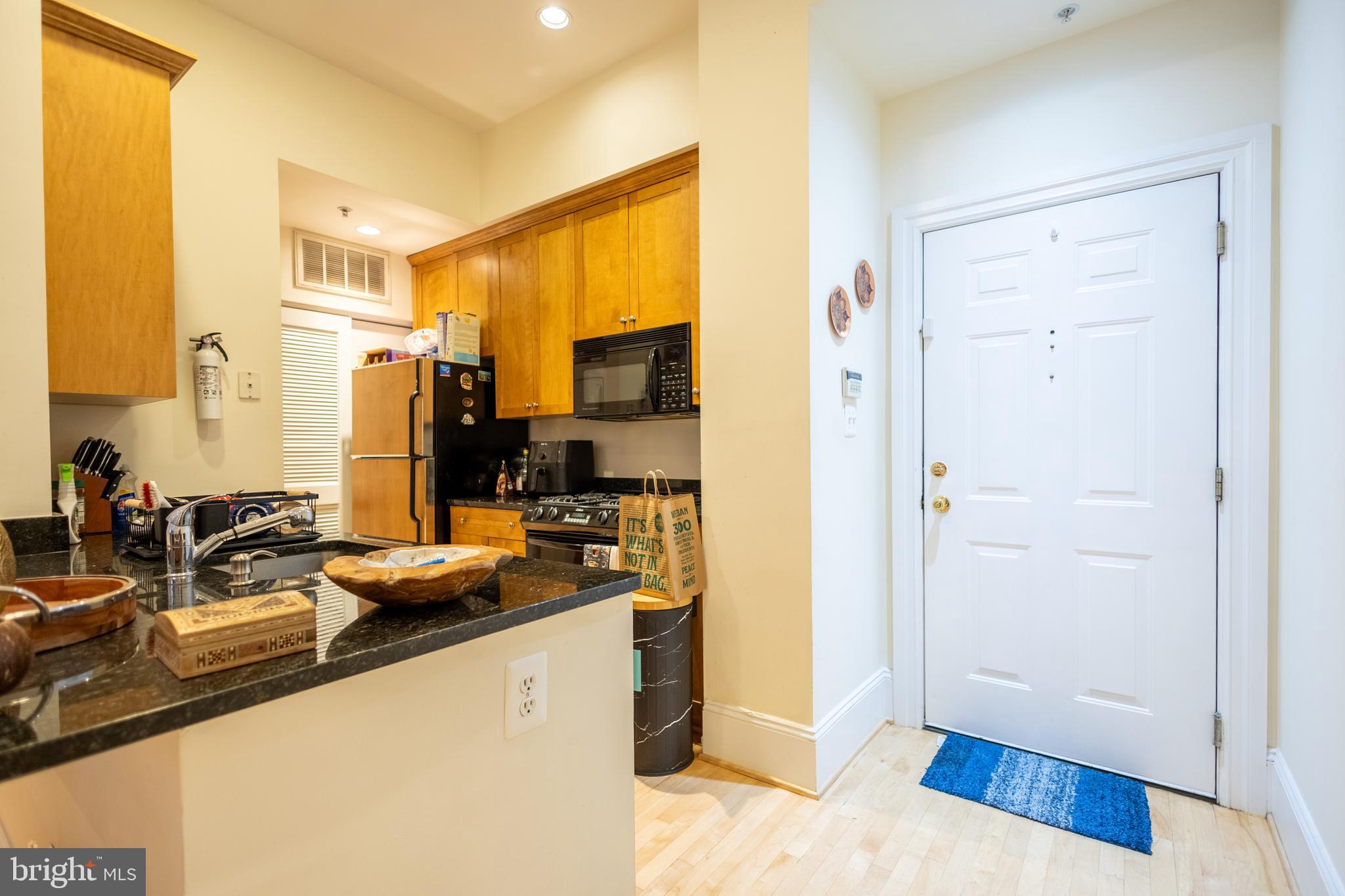 1520 O Street Northwest, Unit 104 Washington, DC 20005 - Photo 10 of 15 a kitchen with a sink appliances and cabinets