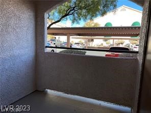 7570 West Flamingo Road, Unit 125 Las Vegas, NV 89147 - Photo 23 of 29 Home theater room featuring a textured wall and healthy amount of natural light