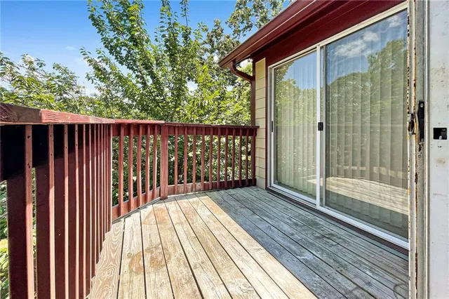 a balcony with wooden floor