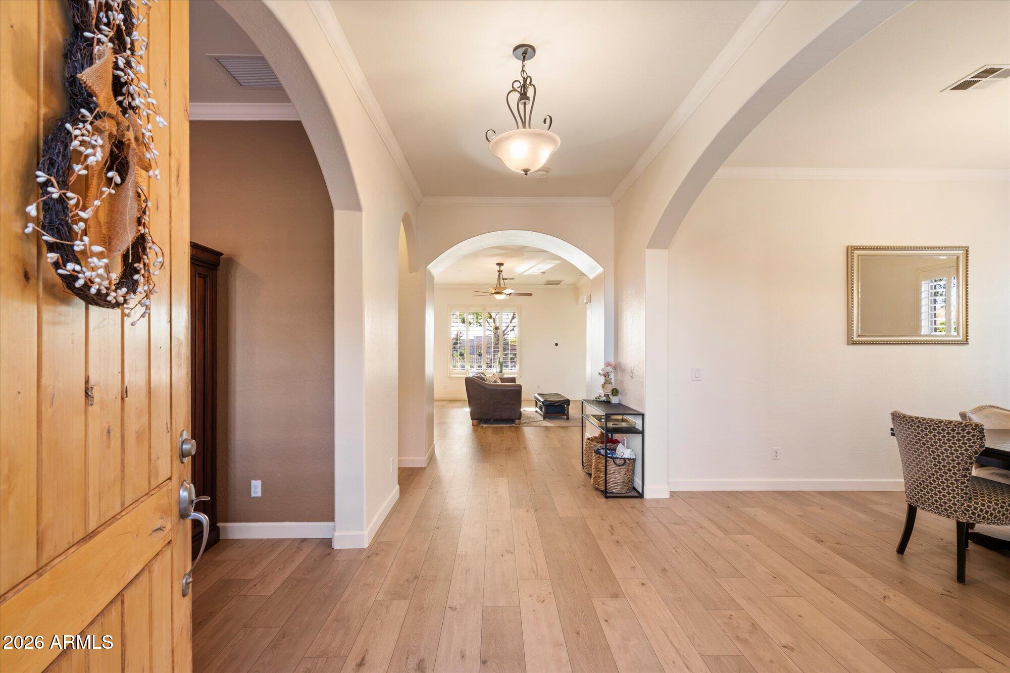 3118 South Colonial Street Gilbert, AZ 85295 - Photo 11 of 38 a view of a livingroom with furniture and hardwood floor