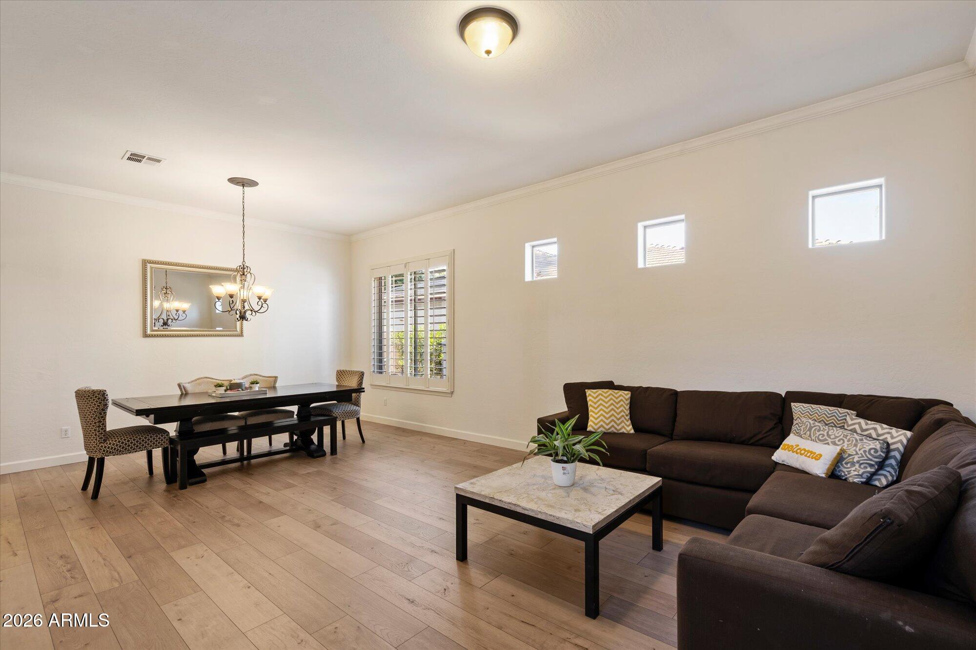 3118 South Colonial Street Gilbert, AZ 85295 - Photo 13 of 38 a living room with furniture and a window