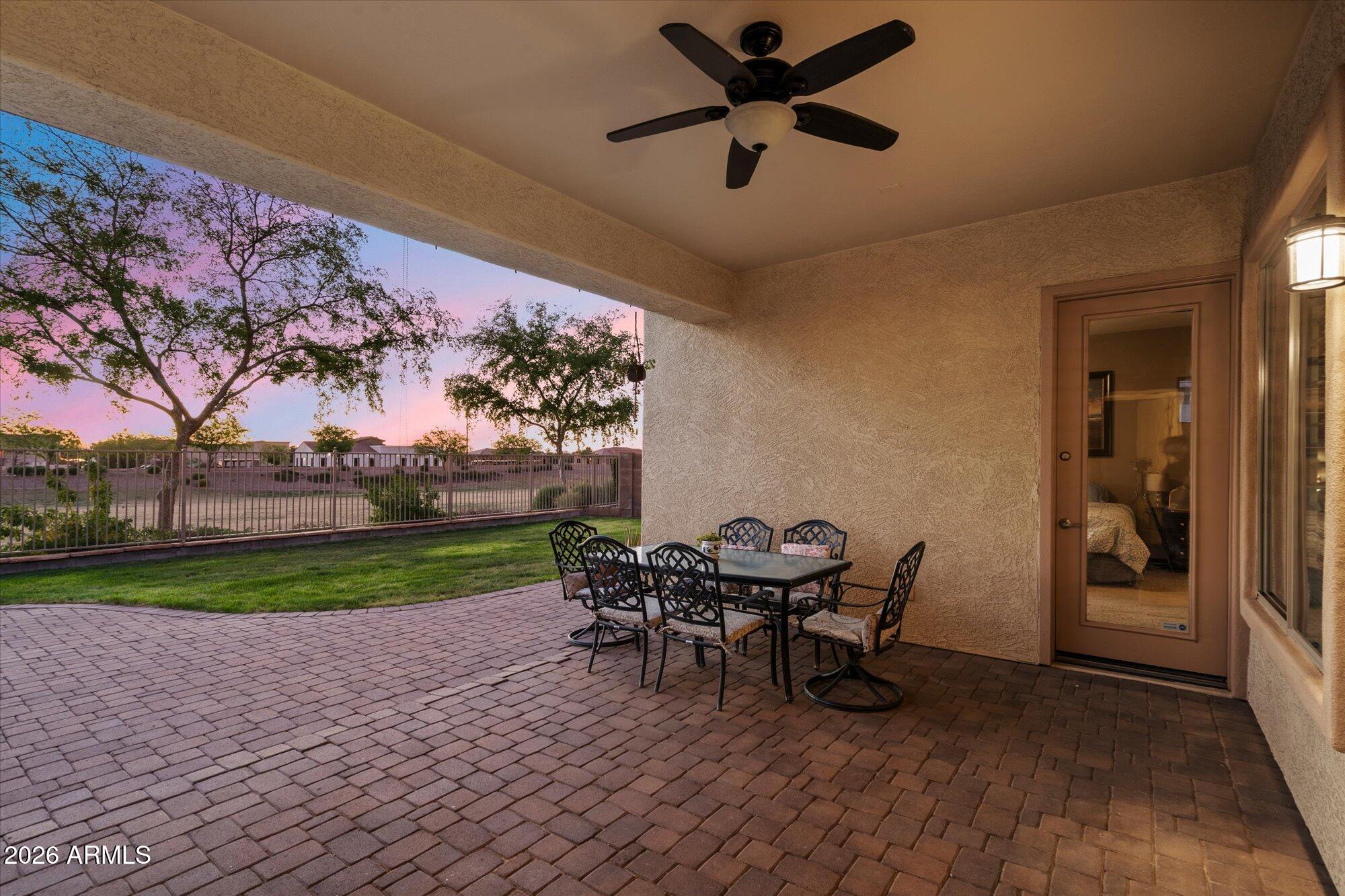 3118 South Colonial Street Gilbert, AZ 85295 - Photo 17 of 38 a view of a porch with chairs and backyard