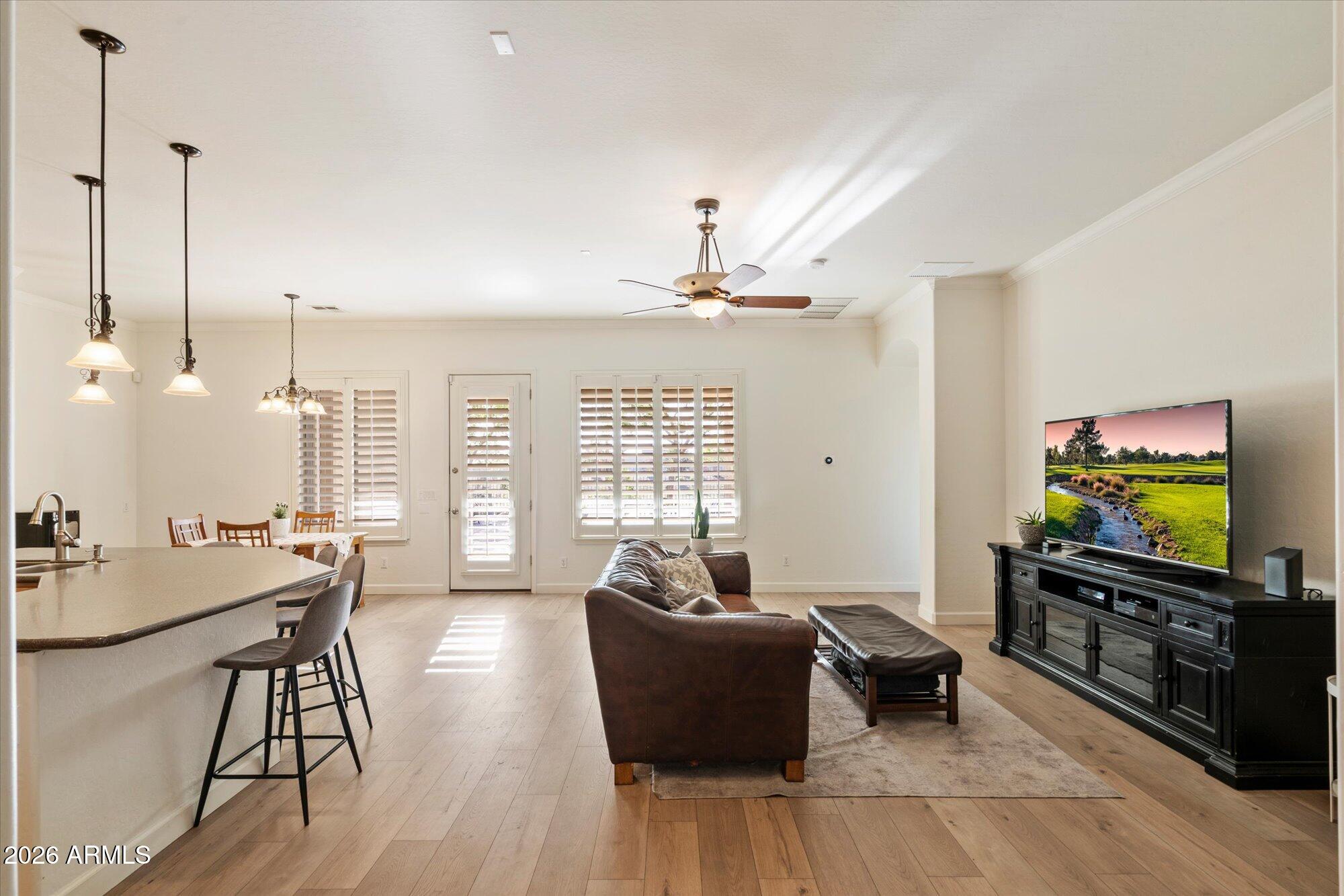 3118 South Colonial Street Gilbert, AZ 85295 - Photo 18 of 38 a living room with furniture and a flat screen tv