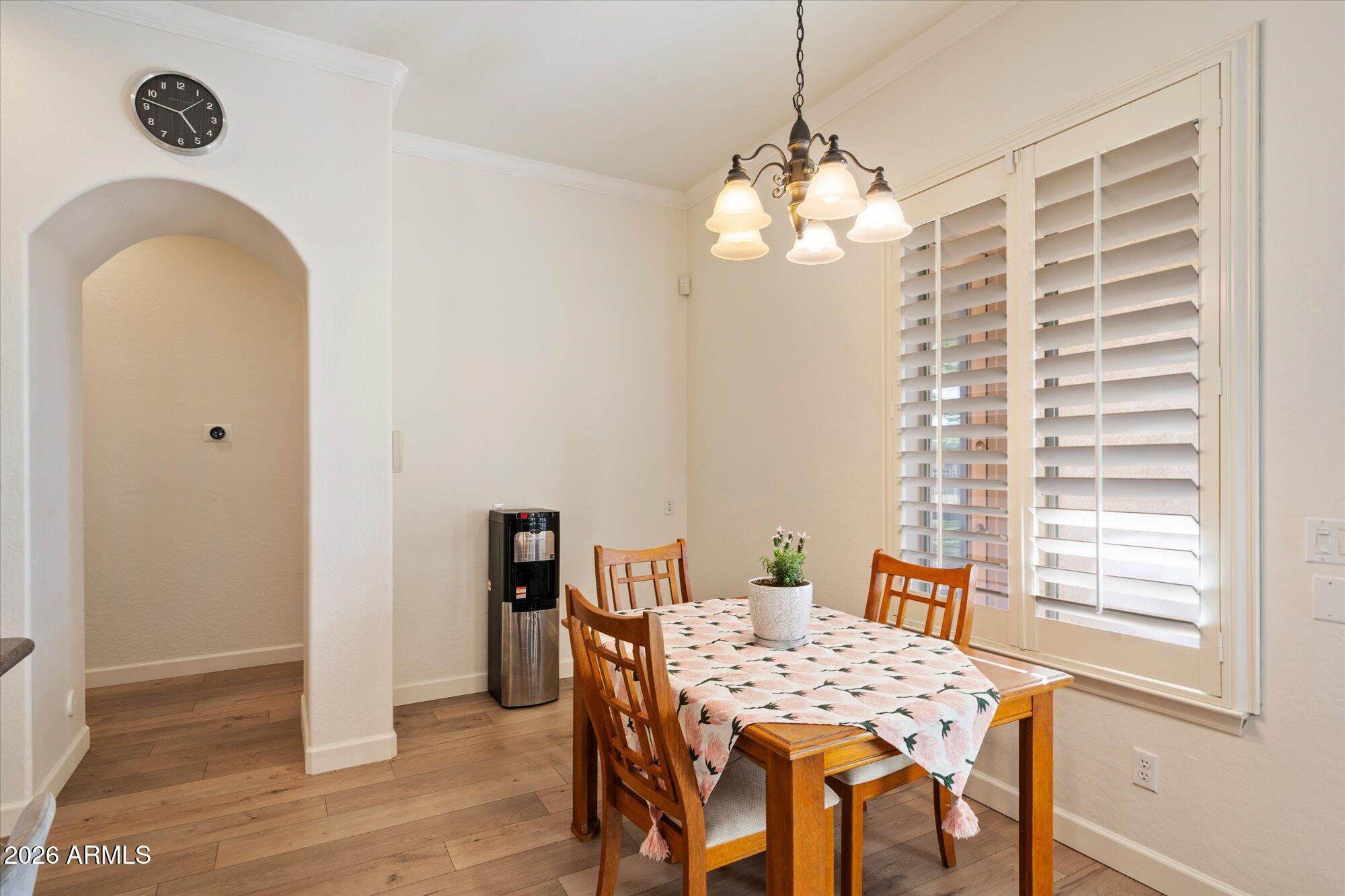 3118 South Colonial Street Gilbert, AZ 85295 - Photo 20 of 38 a view of a dining room with furniture and chandelier