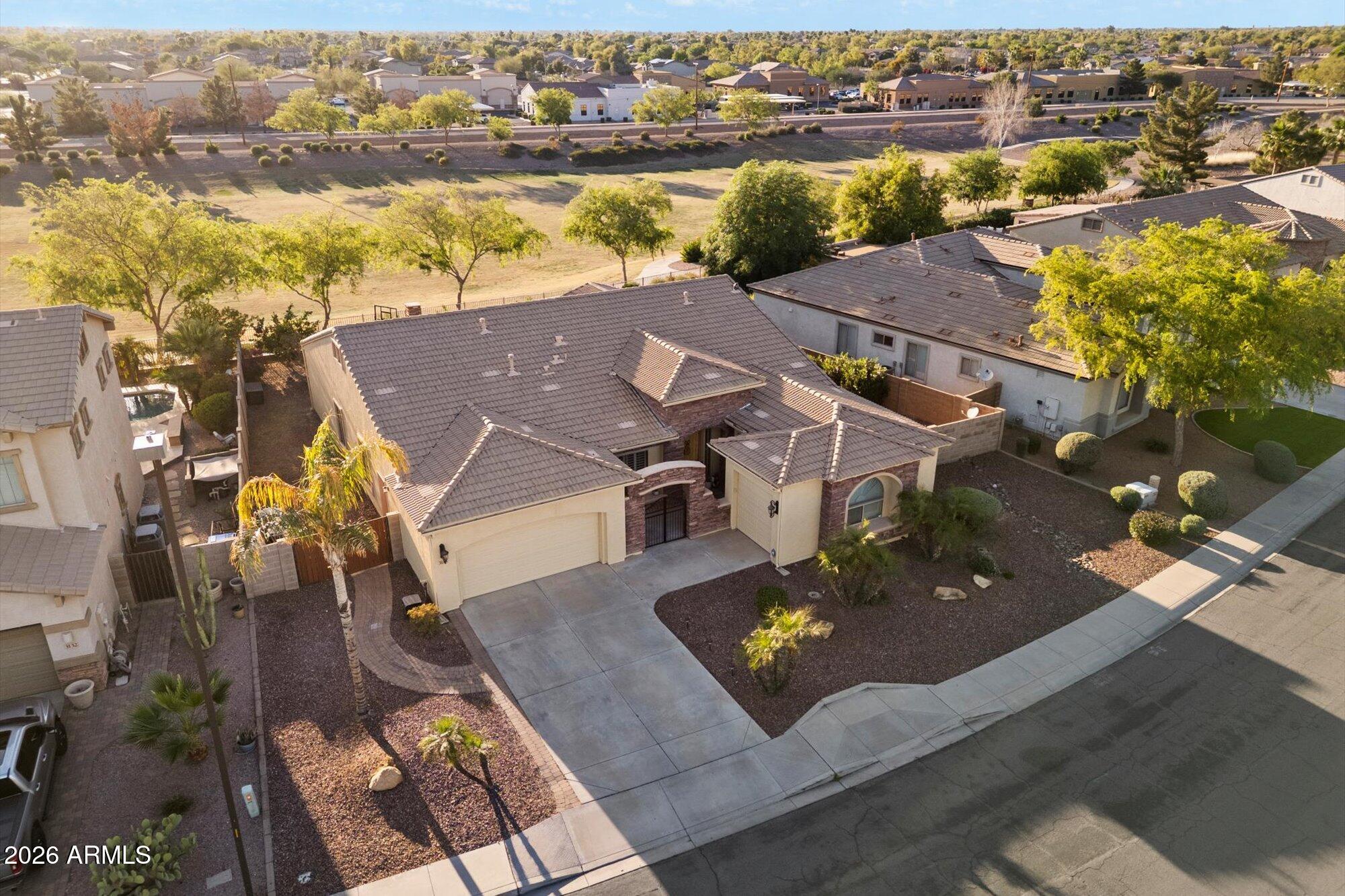 3118 South Colonial Street Gilbert, AZ 85295 - Photo 8 of 38 an aerial view of a house with a ocean view