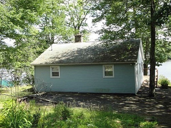 74 Lakeshore Drive Ashburnham, MA 01430 - Photo 11 of 27 a backyard of a house with lots of green space