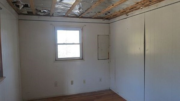74 Lakeshore Drive Ashburnham, MA 01430 - Photo 14 of 27 a view of a small space with wooden floor and a window