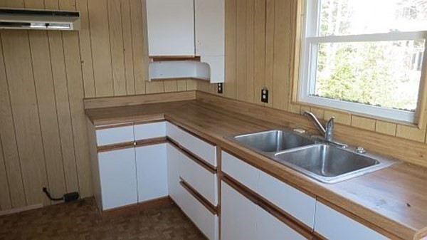 74 Lakeshore Drive Ashburnham, MA 01430 - Photo 18 of 27 a kitchen with a sink and cabinets