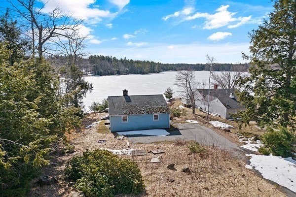 74 Lakeshore Drive Ashburnham, MA 01430 - Photo 2 of 27 a view of a house with a yard and wooden fence
