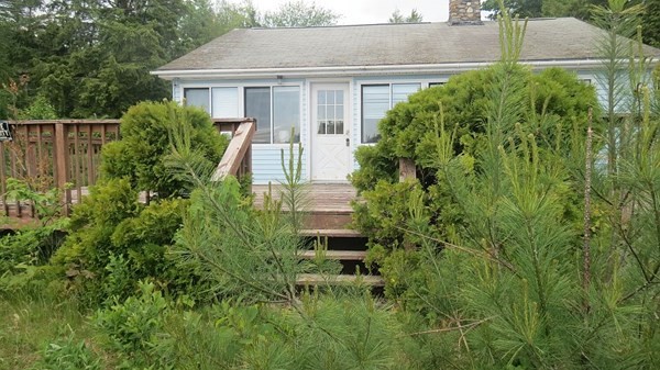 74 Lakeshore Drive Ashburnham, MA 01430 - Photo 23 of 27 a front view of a house with a yard