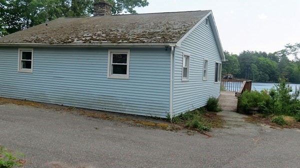 74 Lakeshore Drive Ashburnham, MA 01430 - Photo 25 of 27 a front view of a house with a yard