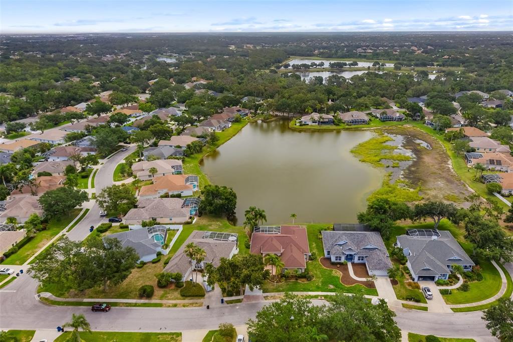 11022 Pine Lilly Place Lakewood Ranch, FL 34202 - Photo 18 of 61 an aerial view of residential houses with outdoor space and river