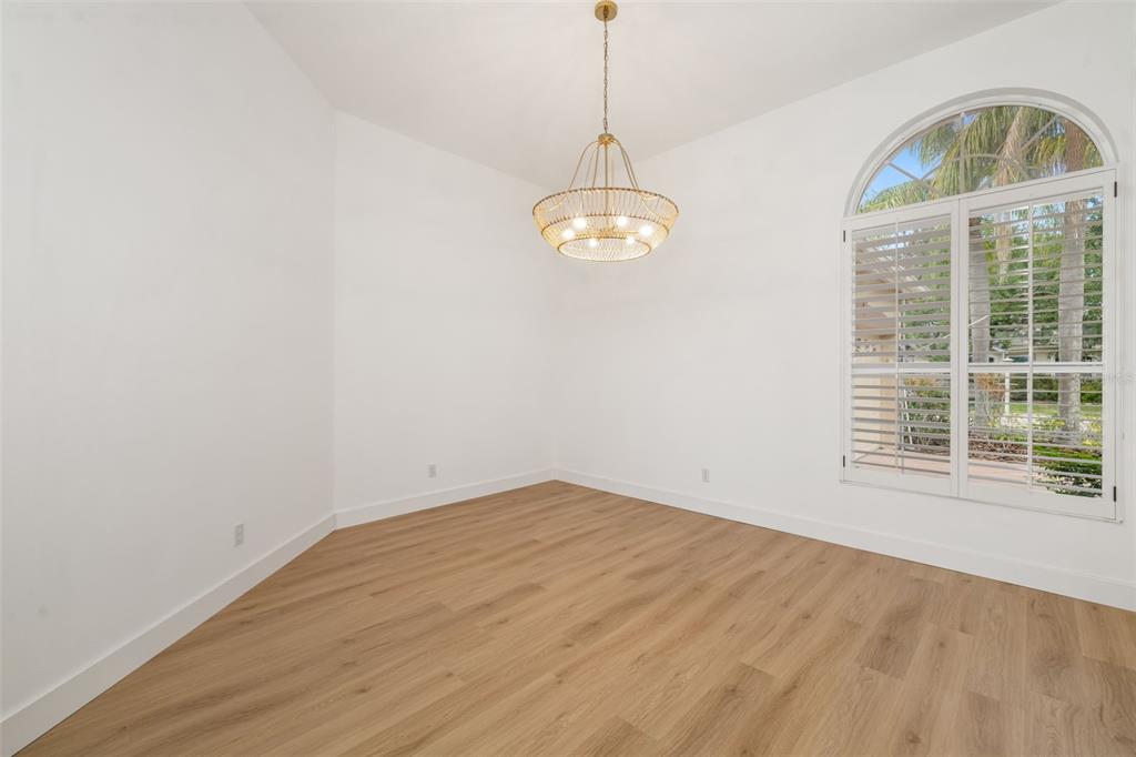 11022 Pine Lilly Place Lakewood Ranch, FL 34202 - Photo 24 of 61 a view of empty room with wooden floor and window