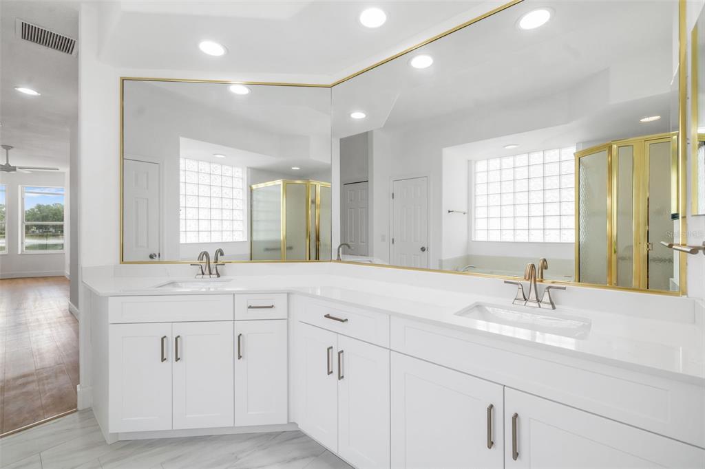 11022 Pine Lilly Place Lakewood Ranch, FL 34202 - Photo 29 of 61 a bathroom with double sink and a mirror