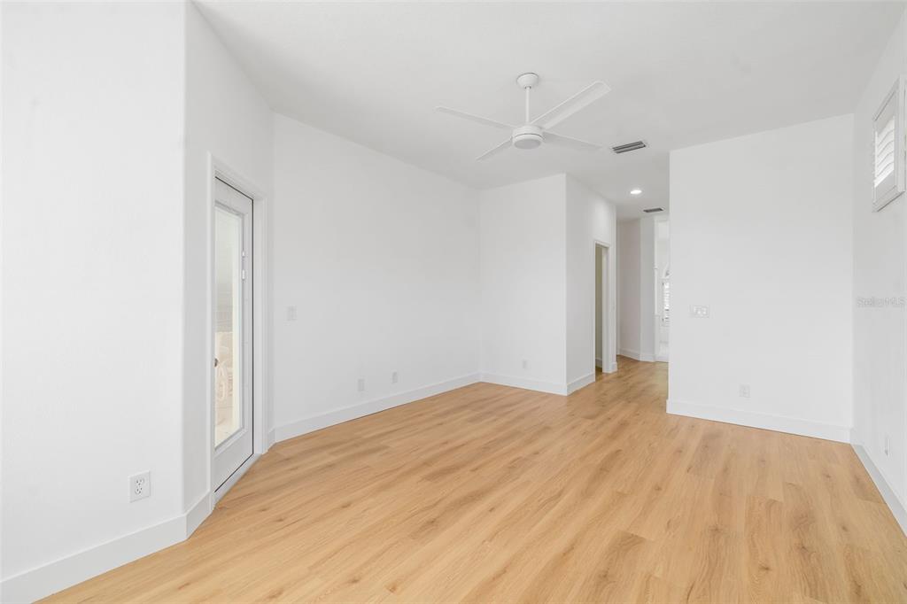 11022 Pine Lilly Place Lakewood Ranch, FL 34202 - Photo 31 of 61 a view of empty room with wooden floor