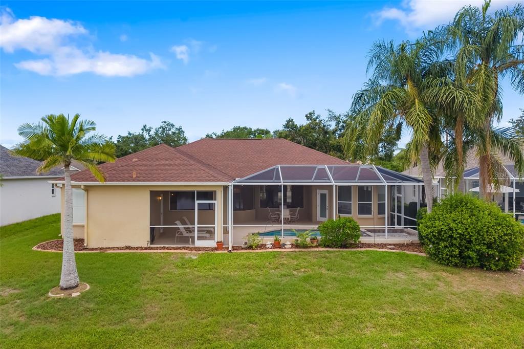 11022 Pine Lilly Place Lakewood Ranch, FL 34202 - Photo 57 of 61 a front view of a house with a garden