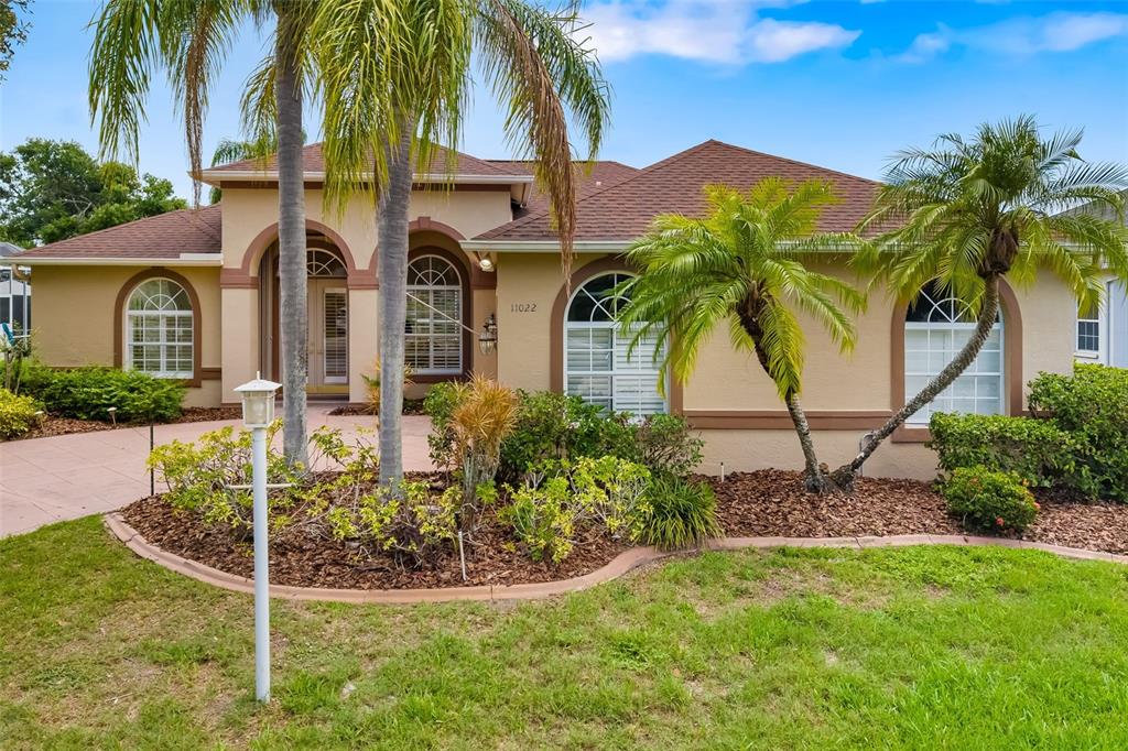 11022 Pine Lilly Place Lakewood Ranch, FL 34202 - Photo 60 of 61 a front view of house with yard and green space