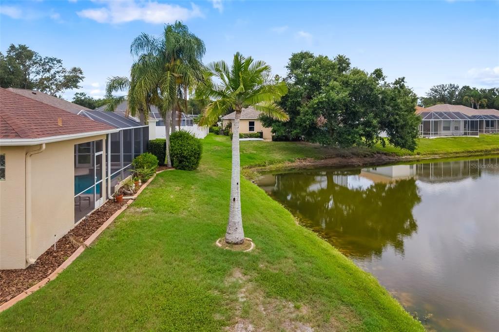 11022 Pine Lilly Place Lakewood Ranch, FL 34202 - Photo 61 of 61 a view of a house with a yard and a fountain