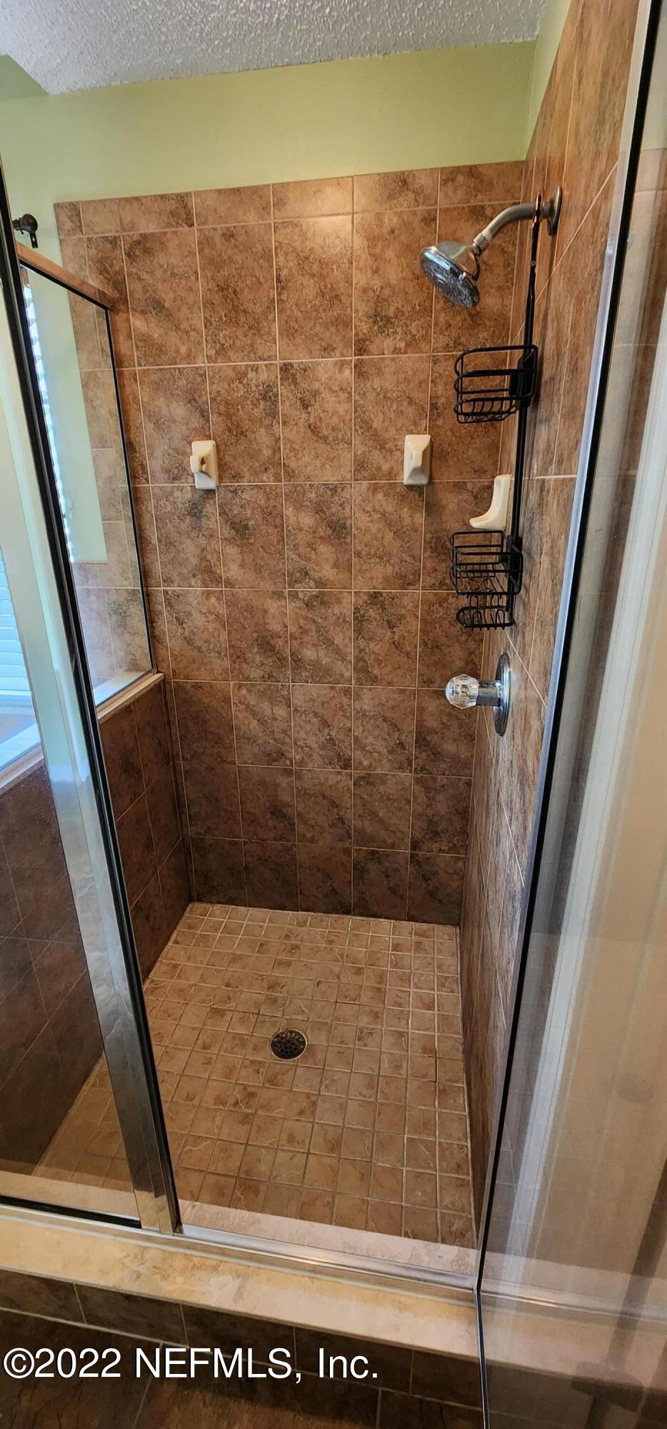 1641 Spring Oaks Lane Jacksonville, FL 32221 - Photo 18 of 40 a bathroom with a window