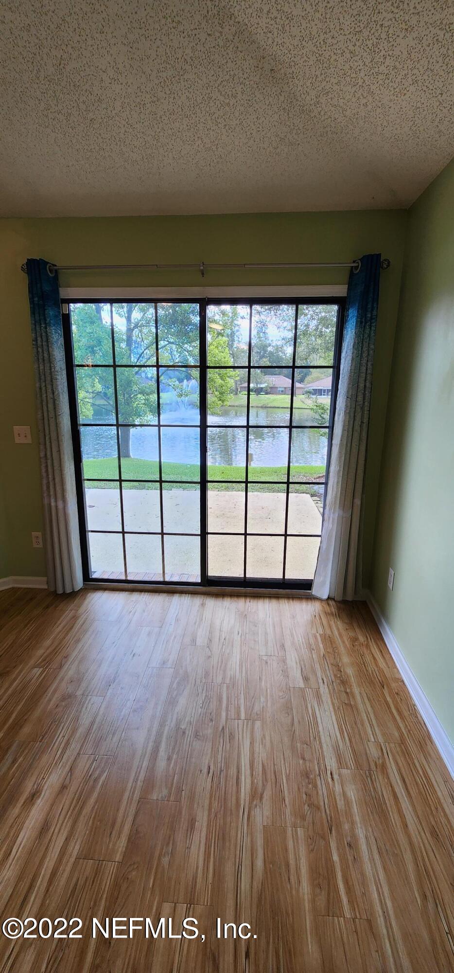 1641 Spring Oaks Lane Jacksonville, FL 32221 - Photo 23 of 40 wooden floor in an empty room with a window
