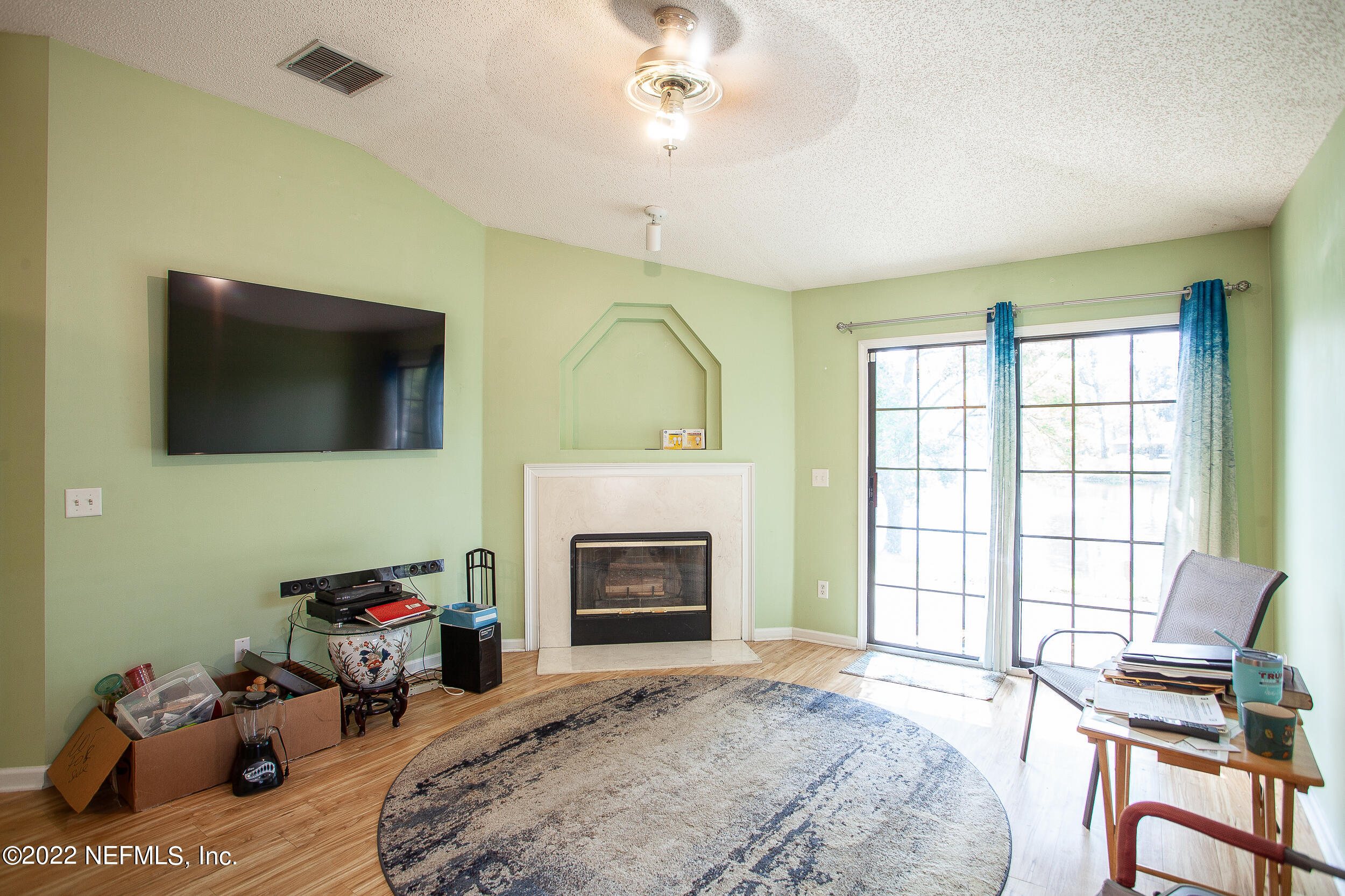 1641 Spring Oaks Lane Jacksonville, FL 32221 - Photo 24 of 40 a bedroom with furniture fireplace and window