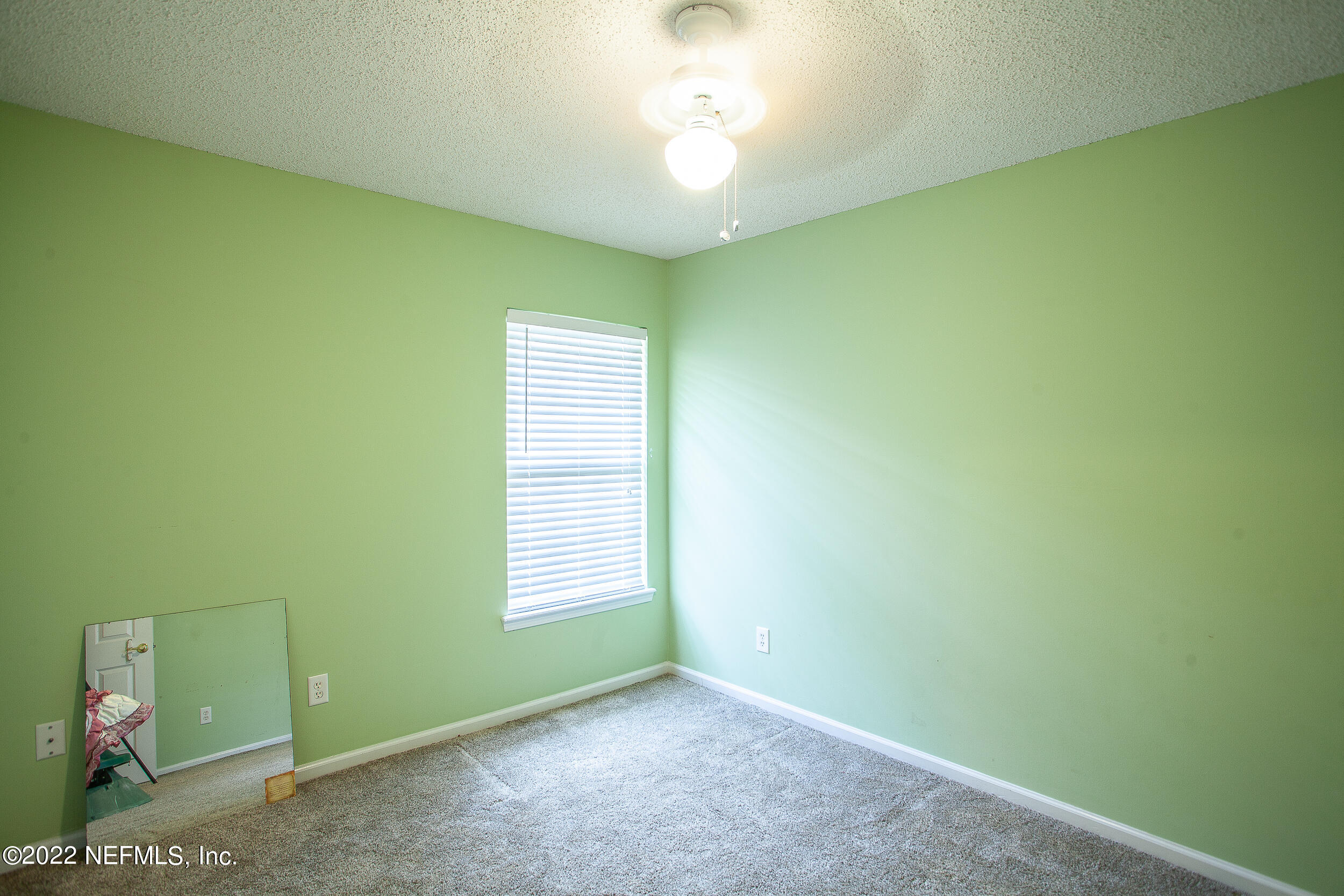 1641 Spring Oaks Lane Jacksonville, FL 32221 - Photo 27 of 40 a view of a room with a window and a ceiling fan
