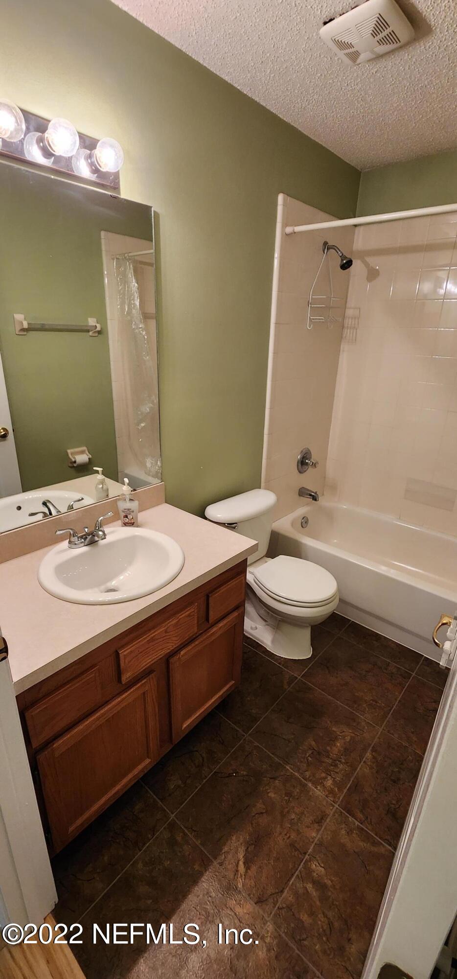 1641 Spring Oaks Lane Jacksonville, FL 32221 - Photo 36 of 40 a bathroom with a sink a toilet and shower