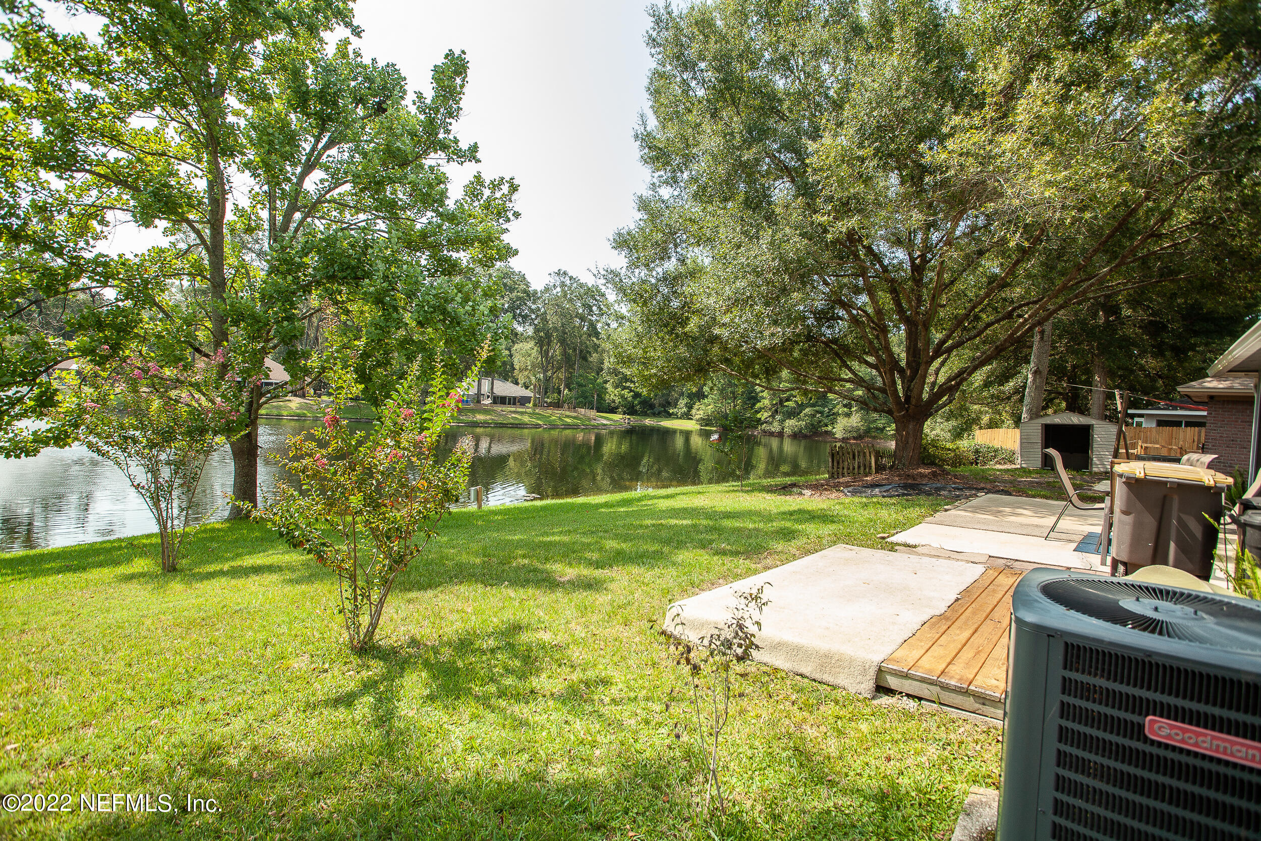 1641 Spring Oaks Lane Jacksonville, FL 32221 - Photo 4 of 40 a view of yard with swimming pool and trees