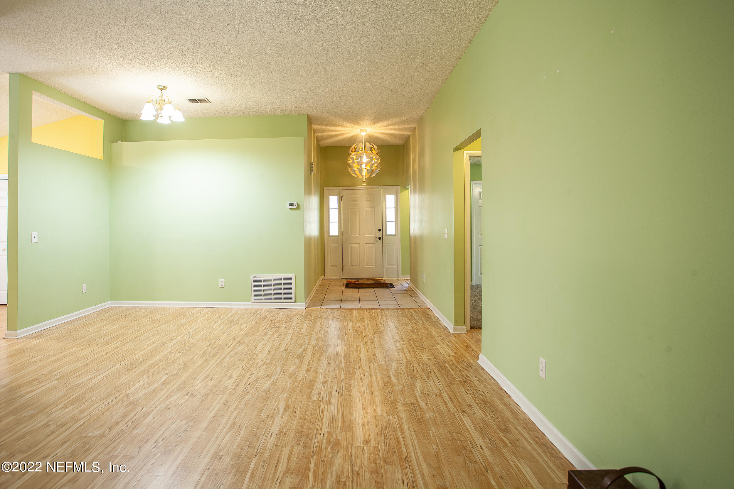 1641 Spring Oaks Lane Jacksonville, FL 32221 - Photo 7 of 40 a view of a room with wooden floor and brick walls