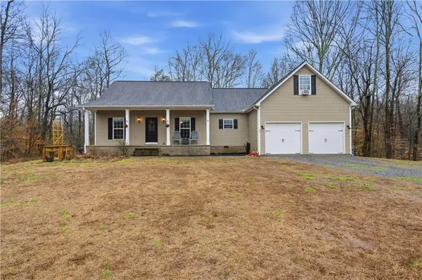 a house with trees in the background