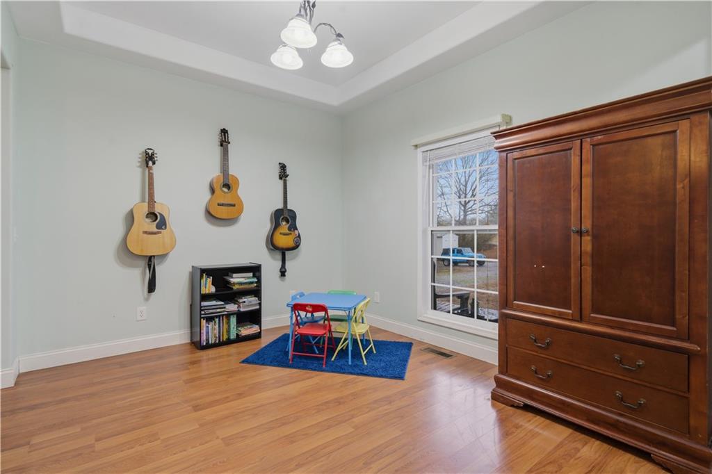 323 Lloyd Way Resaca, GA 30735 - Photo 11 of 43 a view of a workspace with furniture and wooden floor