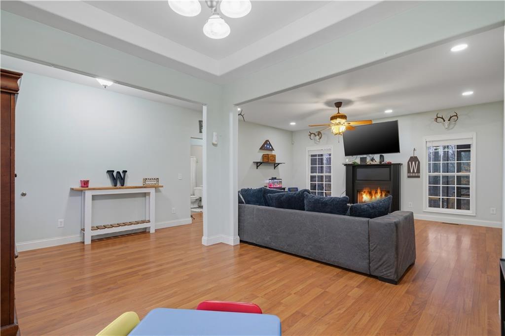 323 Lloyd Way Resaca, GA 30735 - Photo 13 of 43 a living room with furniture and a fireplace