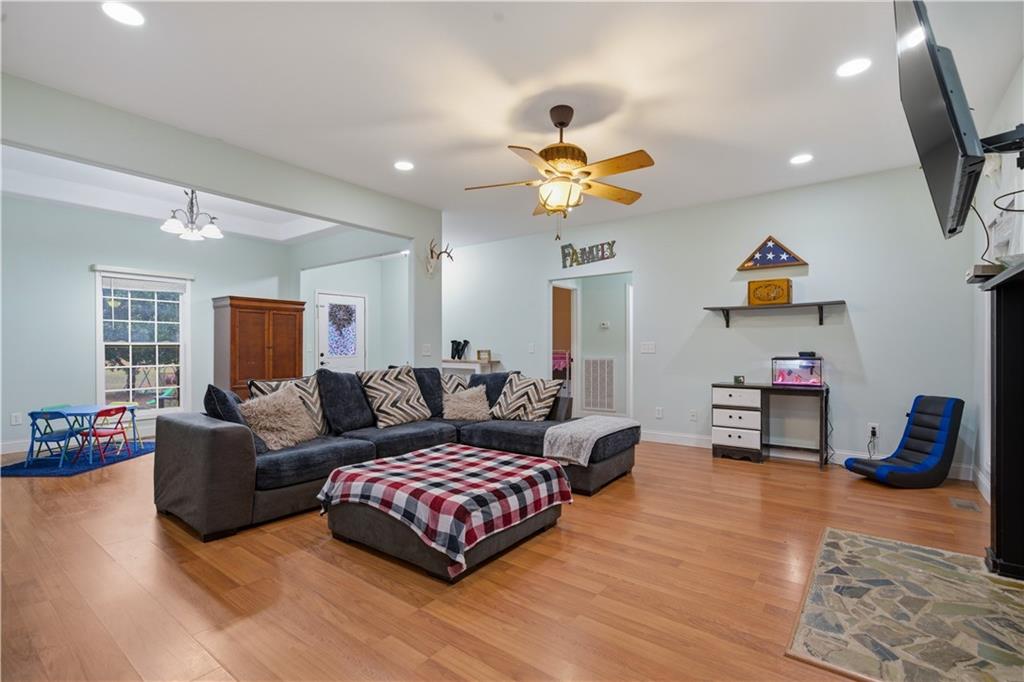 323 Lloyd Way Resaca, GA 30735 - Photo 17 of 43 a living room with furniture and a flat screen tv