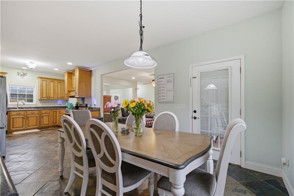 323 Lloyd Way Resaca, GA 30735 - Photo 20 of 43 a view of a dining room and livingroom with furniture wooden floor a chandelier