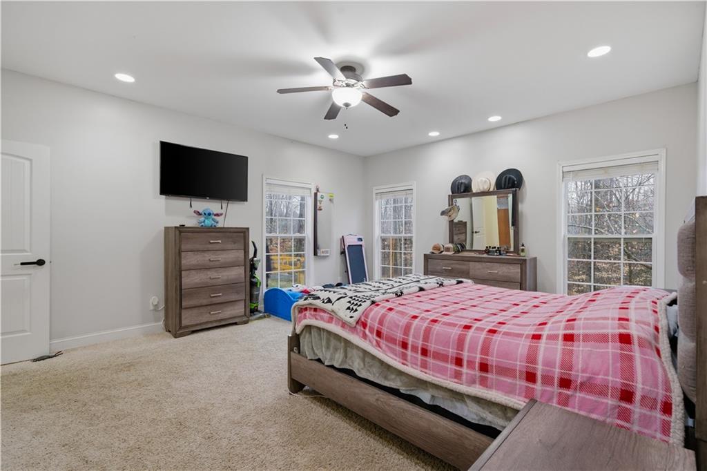 323 Lloyd Way Resaca, GA 30735 - Photo 24 of 43 a bedroom with a bed and a flat screen tv