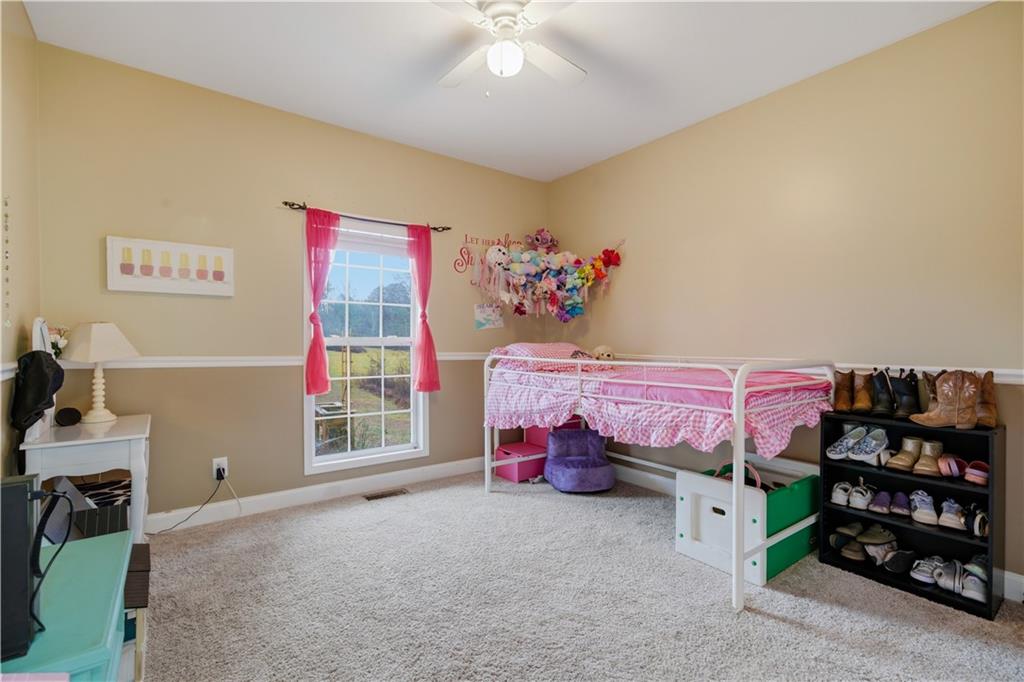 323 Lloyd Way Resaca, GA 30735 - Photo 26 of 43 a bedroom with furniture and a bed