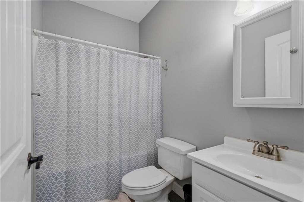 323 Lloyd Way Resaca, GA 30735 - Photo 27 of 43 a bathroom with a sink toilet and shower