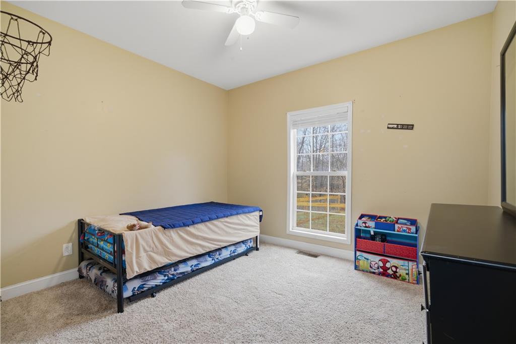 323 Lloyd Way Resaca, GA 30735 - Photo 28 of 43 a living room with a bed furniture and a window