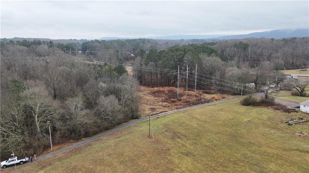 323 Lloyd Way Resaca, GA 30735 - Photo 38 of 43 a view of a road with a yard and mountain view