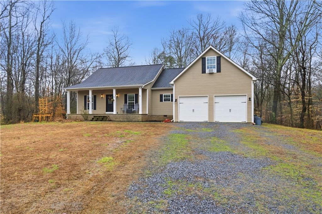 323 Lloyd Way Resaca, GA 30735 - Photo 42 of 43 a view of a house with a yard covered in snow